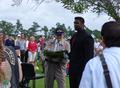 Survivor of the Battle of the Bulge placing ceremonial wreath